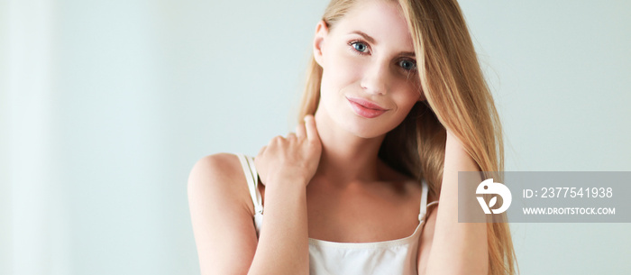 Portrait of beautiful woman isolated on gray background