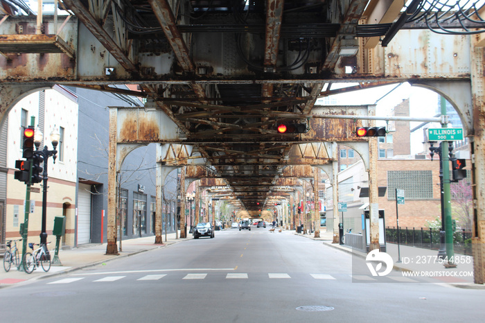 Nearly deserted Franklin Street beneath the el tracks in Chicagos River North neighborhood during t