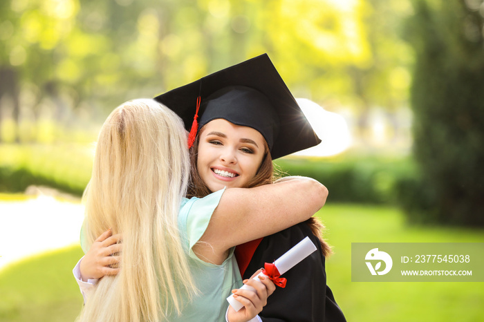 Happy mother greeting her daughter on graduation day