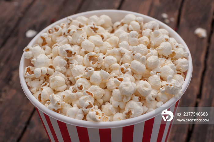 Popcorn in the box on the wooden table