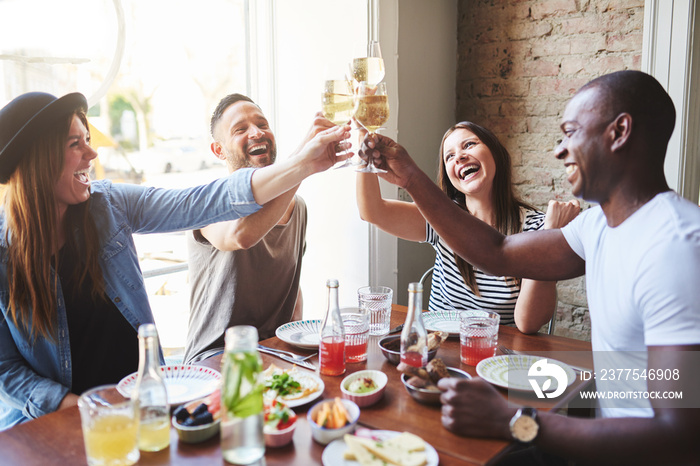 People at reunion on restaurant making toast