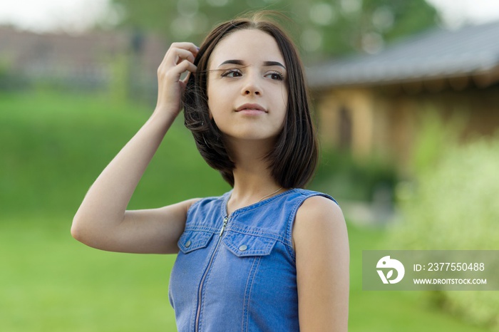 Outdoor portrait of a pretty young girl 16 years old.