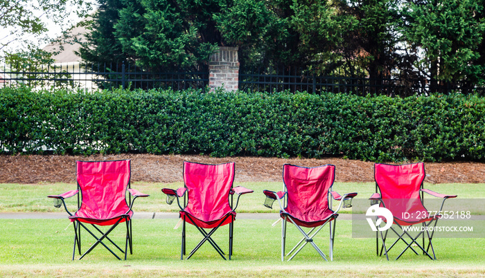 Four Empty Red Chairs