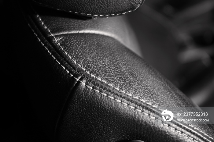 Black leather seat in car interior, closeup