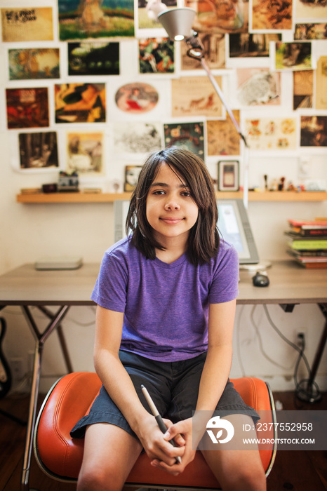 Portrait of girl sitting on stool