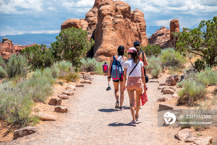 Back view of tourists visiting US National Park in summertime