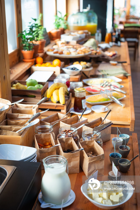 Breakfast buffet table filed with  assorted foods