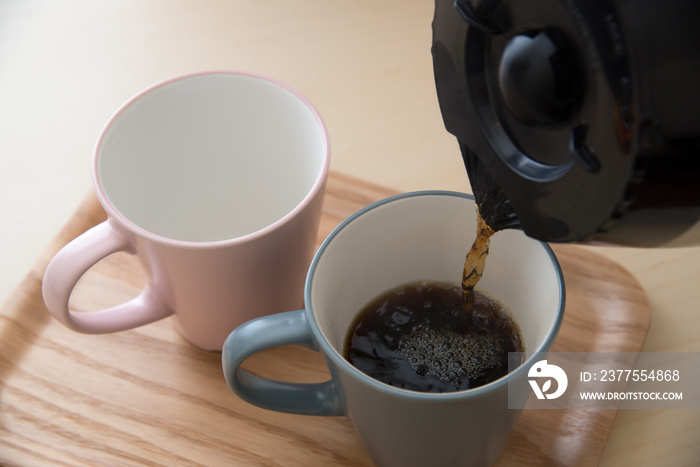 pair of mug and coffee pot