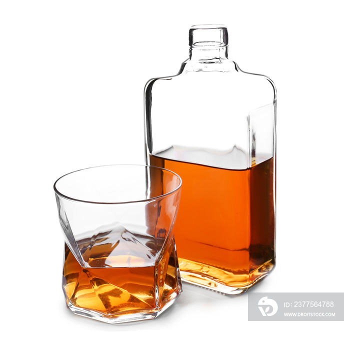 Bottle and glass of whiskey on white background