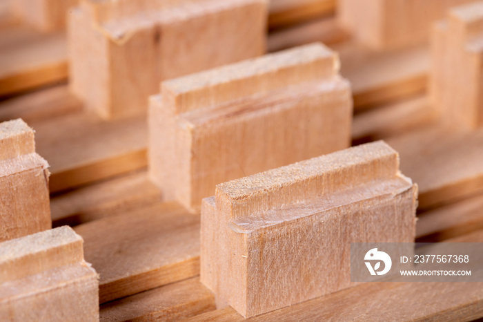 Pieces of wood milled and prepared for gluing. Wooden material used to build furniture.