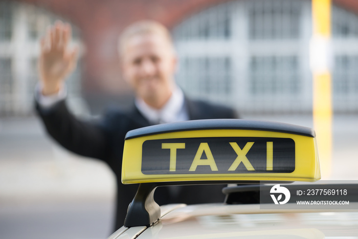 Businessman Catching Taxi