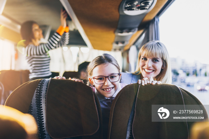 Happy passengers traveling by bus.