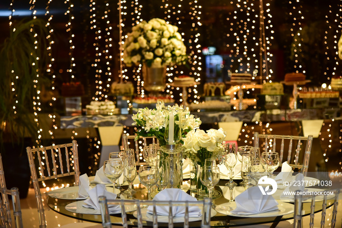 dining table with white flowers and spot lights