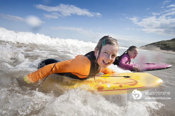 Girls Bodyboarding in the Sea