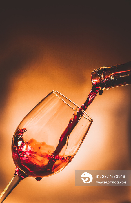 pouring red wine in a glass