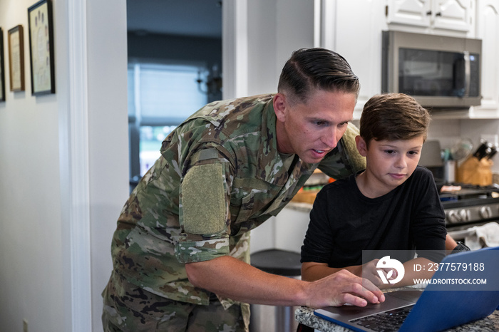 Air Force service member has breakfast with his family before leaving for work.