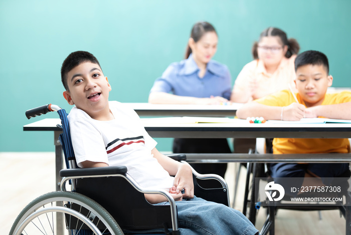 portrait asian disabled kids or autism child sitting on a wheelchair in classroom