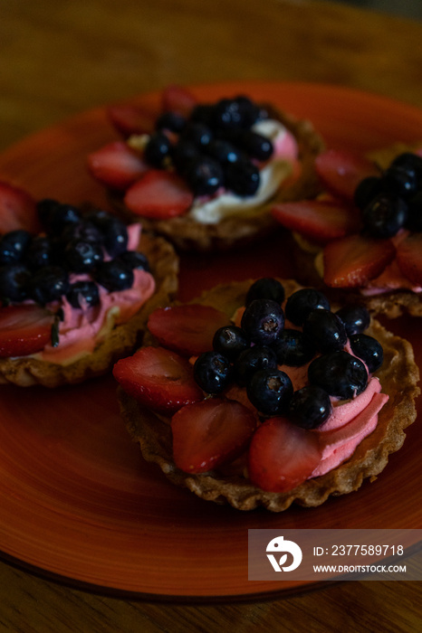 close up of mixed berry tarts