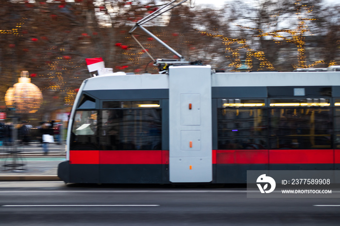 Tram in Vienna near Rathausplatz Christmas market, blurred motion