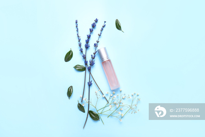 Beautiful composition with perfume bottle on color background