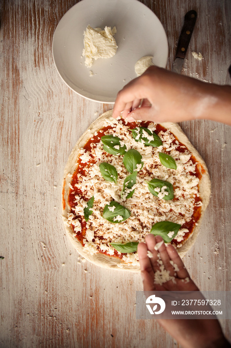 Directly above view of man making pizza