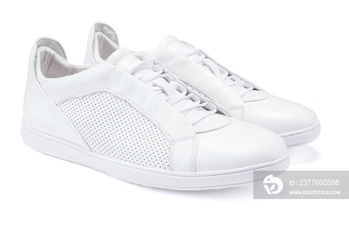 Pair of new white sneakers on white background