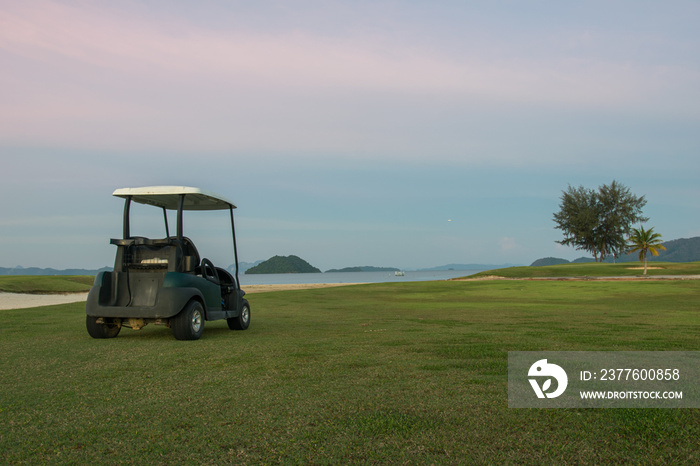 golf cart in golf course sunset time