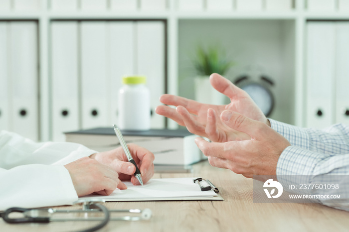 Doctor and patient during consultation in medical office