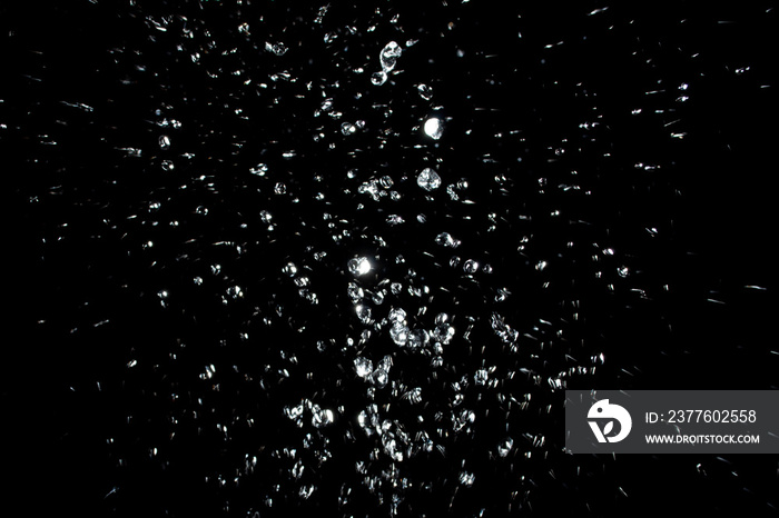 air bubbles in the water isolated on black background