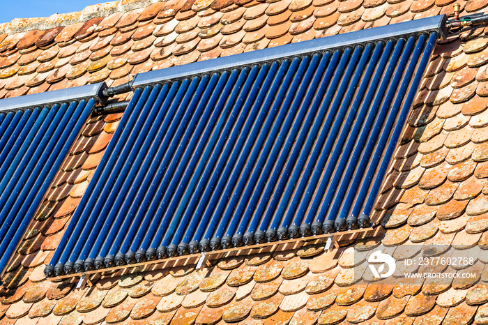 Close up of solar water heater on roof top. Solar panel for hot water, system on roof.