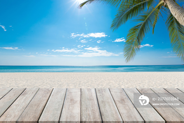 Wooden floor or plank on sand beach. For product display.Calm Sea and Blue Sky Background.tropical in summer.