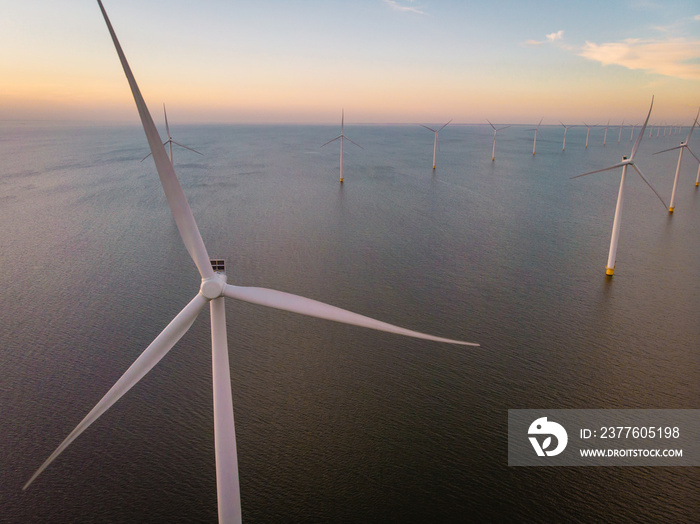 windmill farm drone view from above during sunset, windmill park offshore ocean