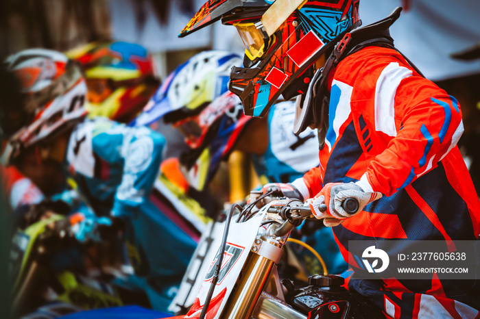 Close-up of biker sitting on motorcycle in starting point before the start of the race