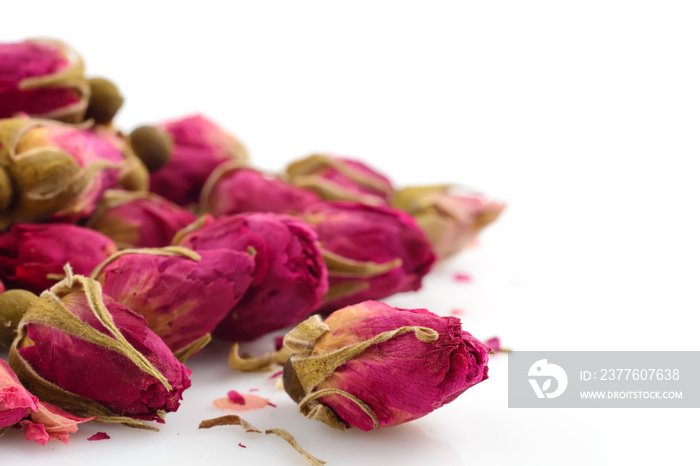 Macro photo of teaspoon buds on a white background. The buds of the tea roses.