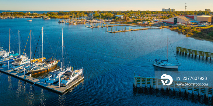 Bayou Chico Marina and Basin with views of moored boats, yachts, Brent Island, Brent’s Mill Wharf, and Pensacola Bay in Florida, USA
