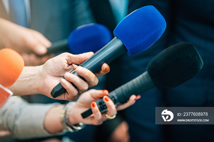 Media interview microphones after a press conference.