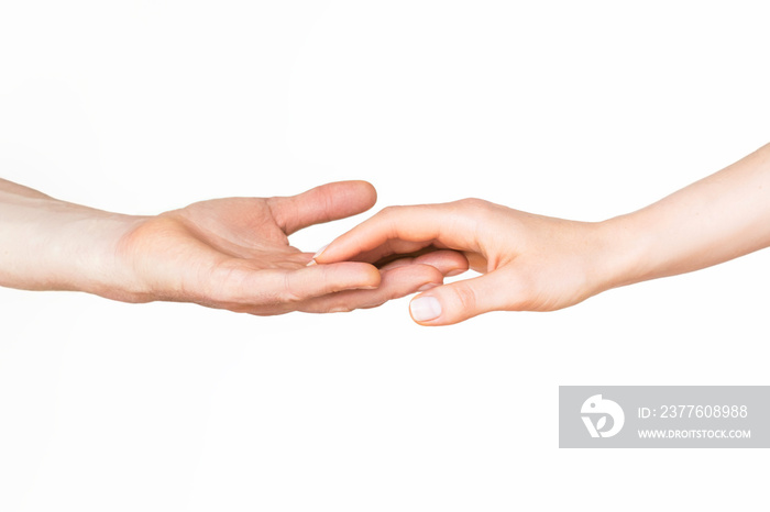 a man and a woman touch and hold hands on a light background. the concept of love and relationships