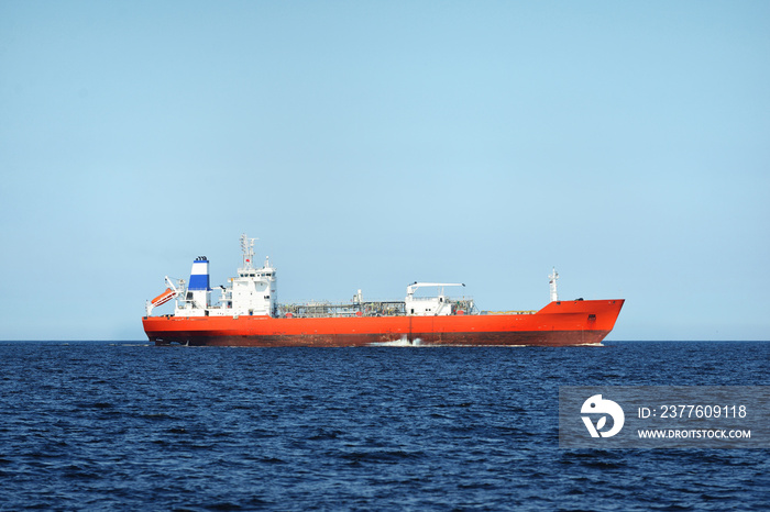 View of a red lpg tanker sailing in a open sea on a clear day