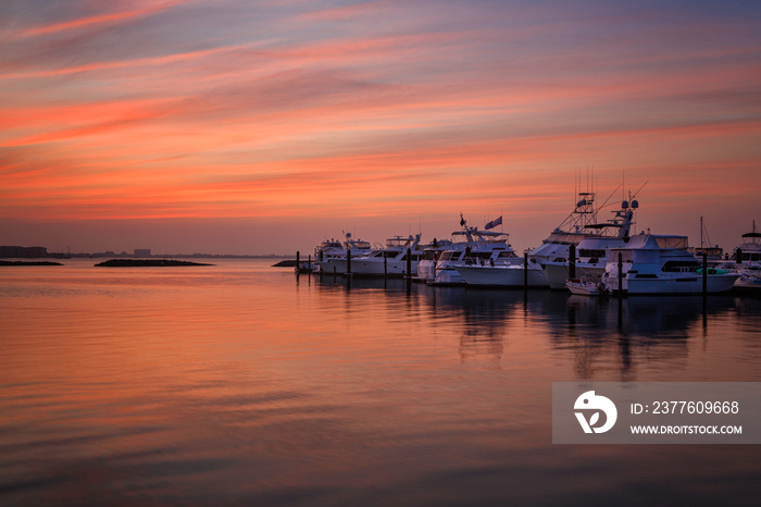 Sunrise over the harbor with boats in Fort Pierce, Florida.