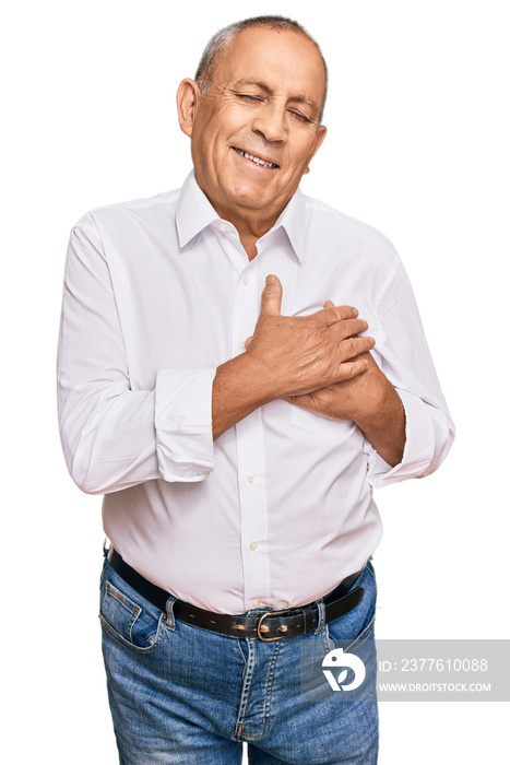 Handsome senior man wearing elegant white shirt smiling with hands on chest with closed eyes and grateful gesture on face. health concept.