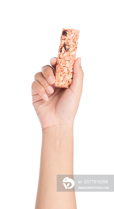 hand holding Munchies health Cereal candy bar isolated on white background.