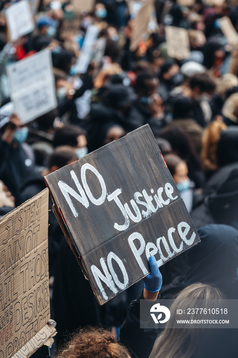 Black Lives Matter protest in London. No justice no peace banner