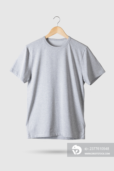 Grey T-Shirt Mock-up on wooden hanger, front side view. 3D Rendering.