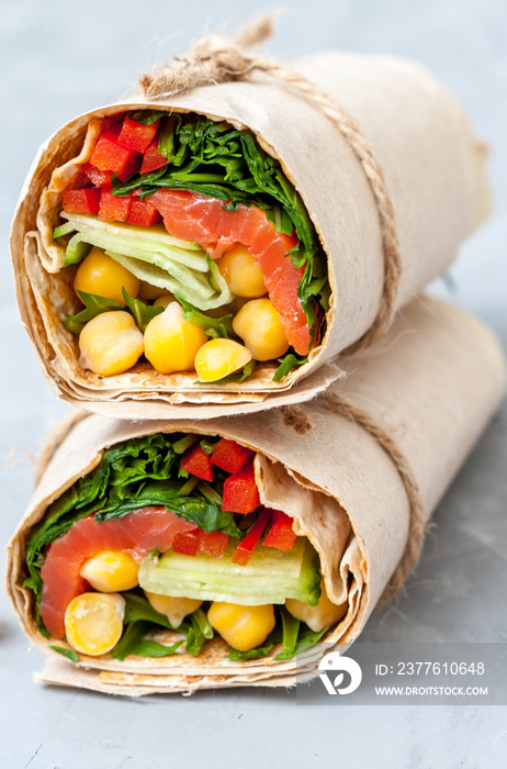 Healthy wraps with salmon and chickpeas for lunch. Love for a healthy food concept