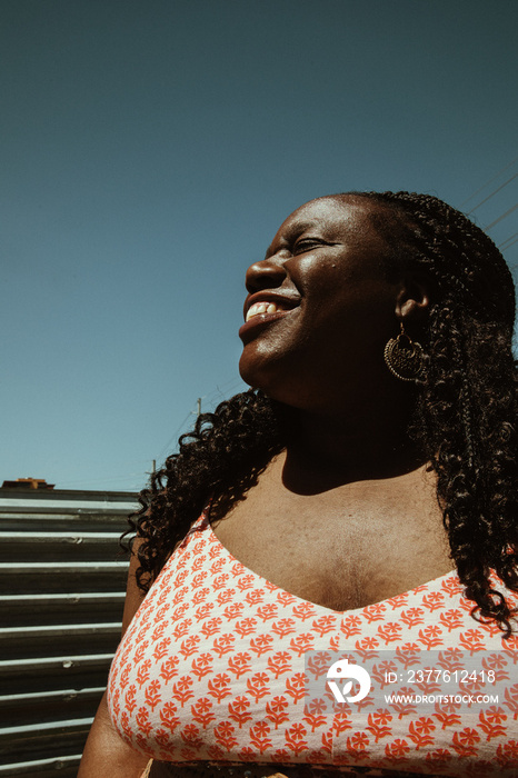 close up portrait of a plus size black woman’s smiling face