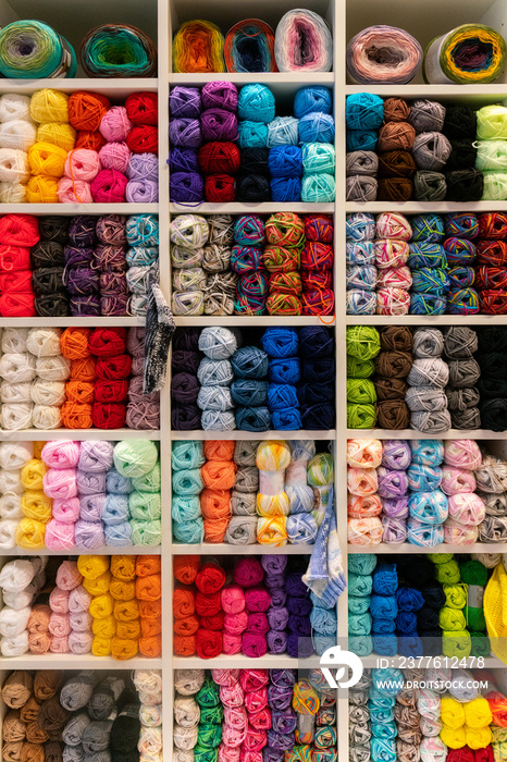 Shelves with colorful yarn store rack.