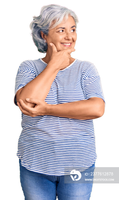 Senior woman with gray hair wearing casual striped clothes with hand on chin thinking about question, pensive expression. smiling with thoughtful face. doubt concept.