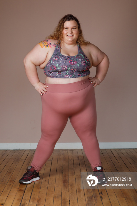 plus size woman standing in power stance