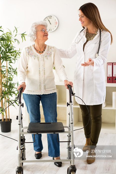 Senior woman with walker on consultation with the doctor