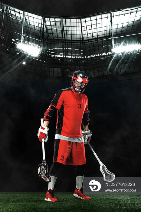 Lacrosse Player, athlete sportsman in red helmet on grand arena background. Sport and motivation wallpaper.